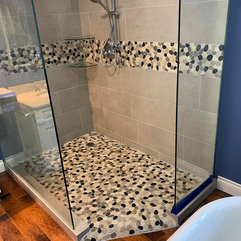 Ricklyn Renos grey pebble shower install