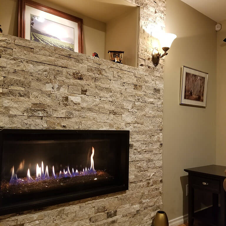 Ricklyn Renos stone surround gas fireplace